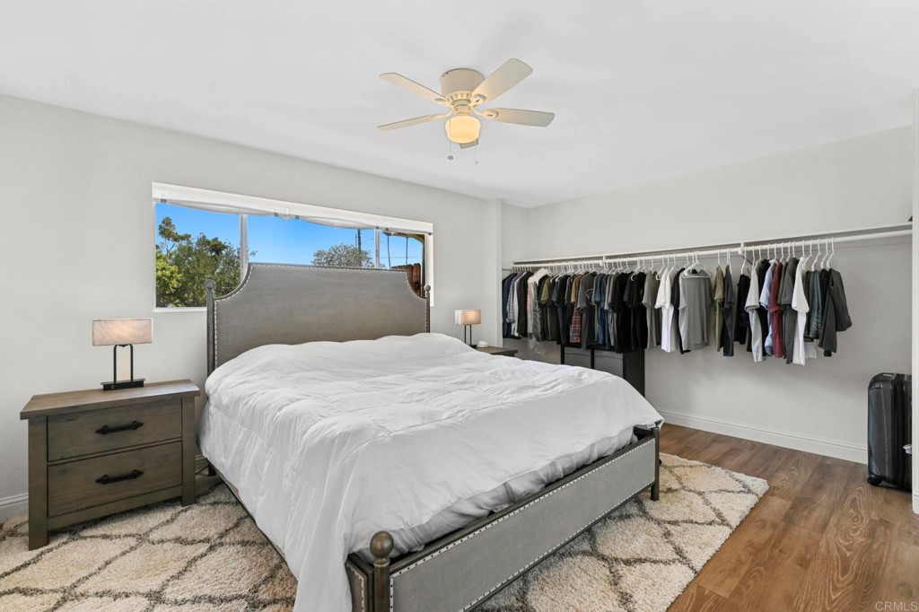 938 Doris Drive Encinitas, CA 92024 - Photo 16 of 31 a bedroom with a bed and ceiling fan