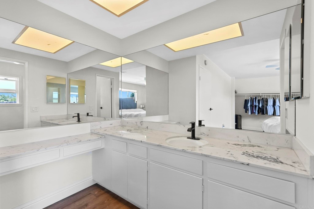 938 Doris Drive Encinitas, CA 92024 - Photo 17 of 31 a bathroom with a sink and a mirror