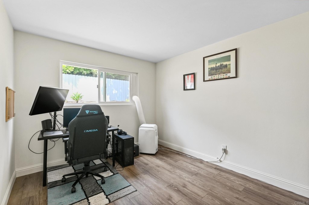 938 Doris Drive Encinitas, CA 92024 - Photo 21 of 31 a view of workspace with wooden floor windows