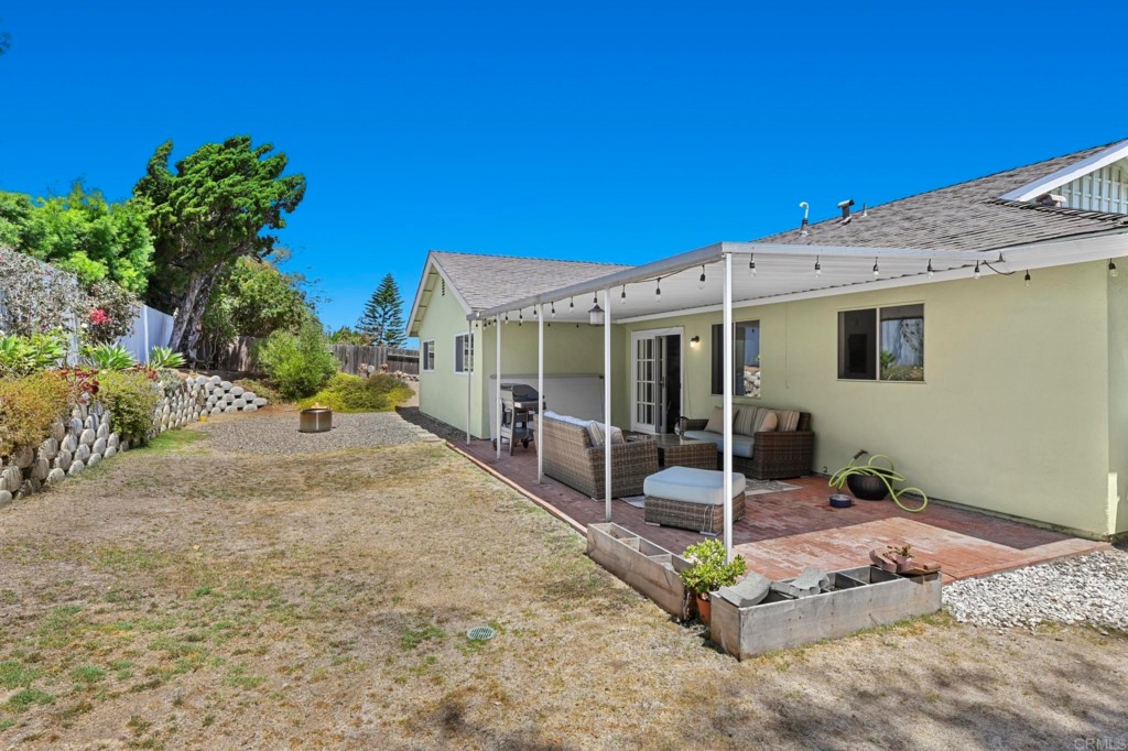 938 Doris Drive Encinitas, CA 92024 - Photo 24 of 31 a view of a house with porch and potted plants