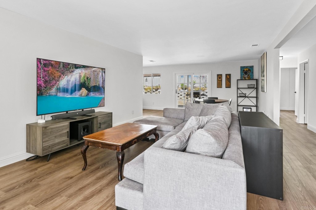 938 Doris Drive Encinitas, CA 92024 - Photo 3 of 31 a living room with furniture and a flat screen tv