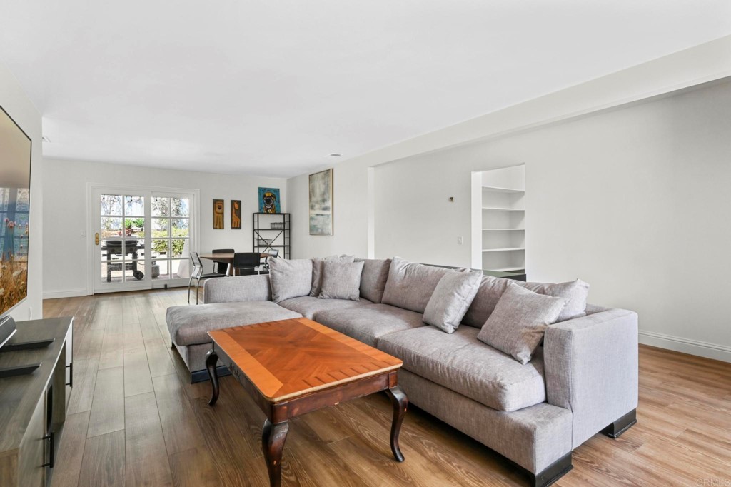 938 Doris Drive Encinitas, CA 92024 - Photo 5 of 31 a living room with furniture and a wooden floor