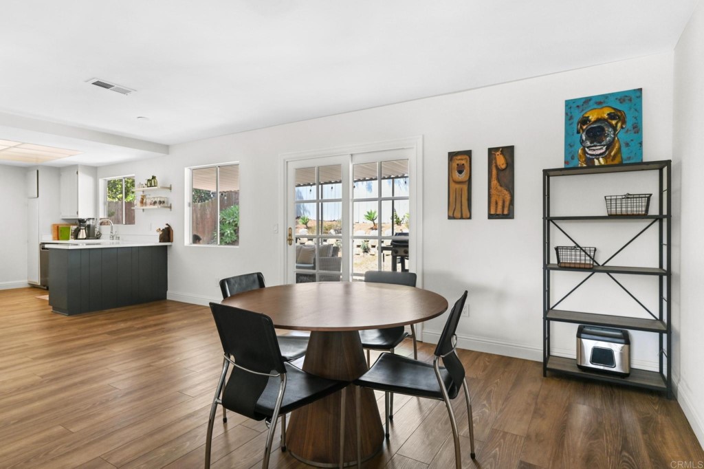938 Doris Drive Encinitas, CA 92024 - Photo 6 of 31 a view of a dining room with furniture and a wooden floor
