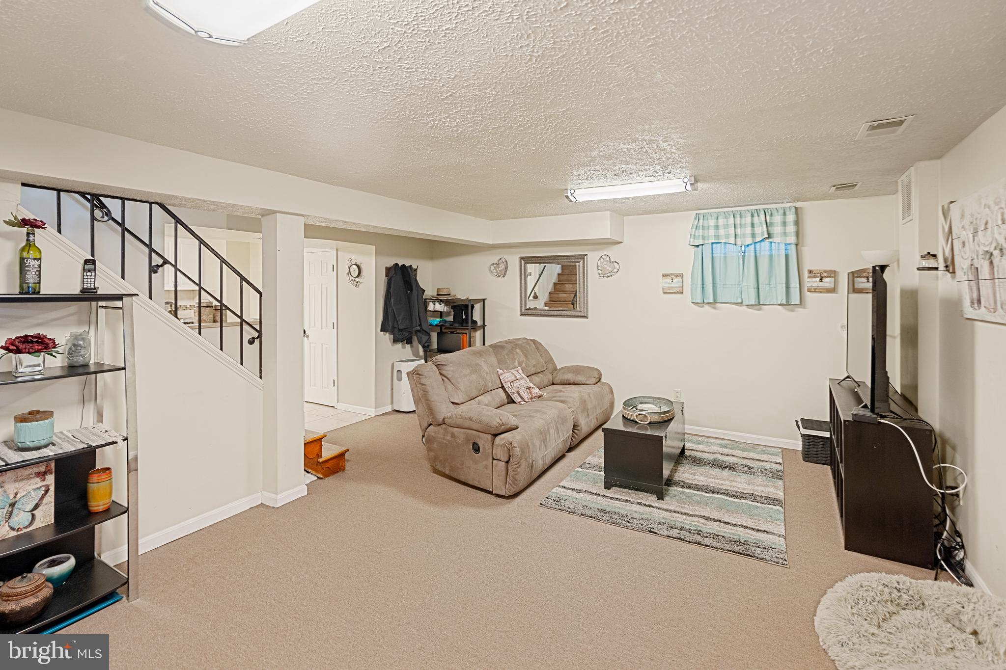 8254 Brattle Road Pikesville, MD 21208 - Photo 15 of 27 lower level rec room