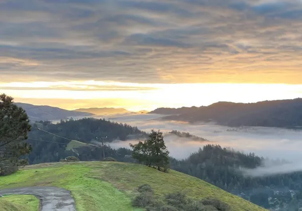 a view of mountain with lake view