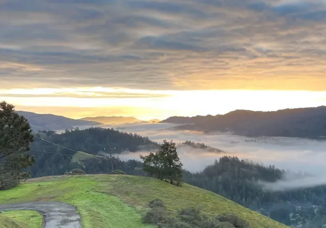 a view of mountain with lake view