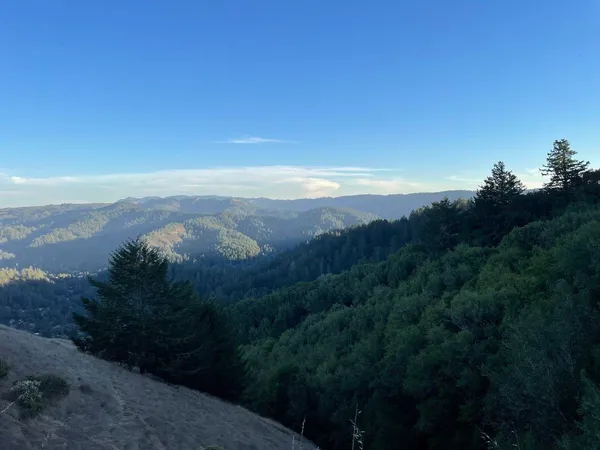 a view of an ocean and mountain