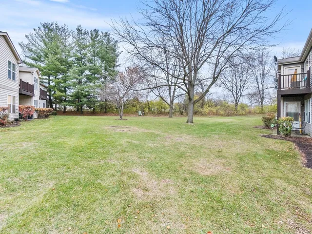 a view of a yard with a house