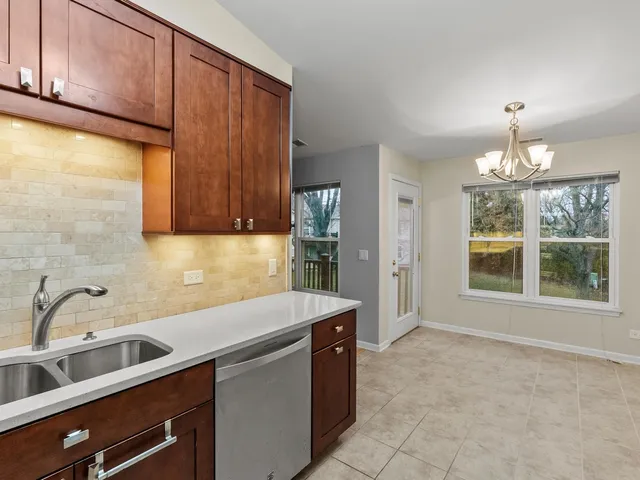 a view of a kitchen with a sink and dishwasher
