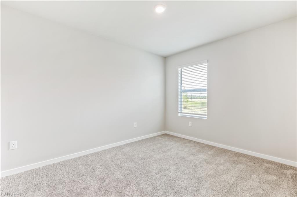 17770 Shade Tree Loop Punta Gorda, FL 33982 - Photo 13 of 47 an empty room with a window