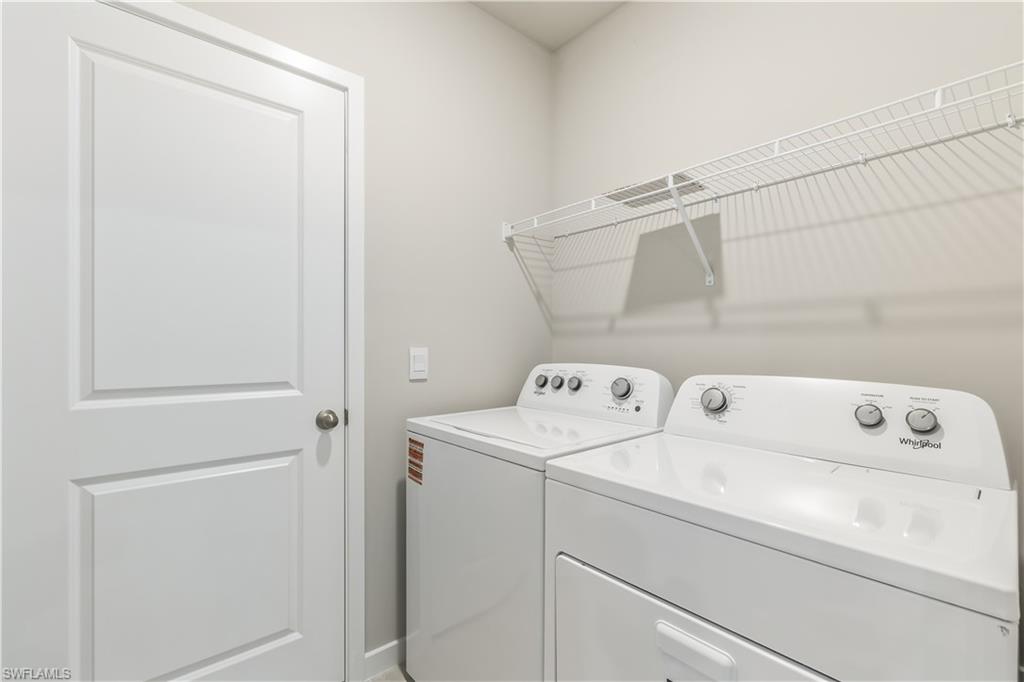 17770 Shade Tree Loop Punta Gorda, FL 33982 - Photo 17 of 47 a utility room with dryer and washer