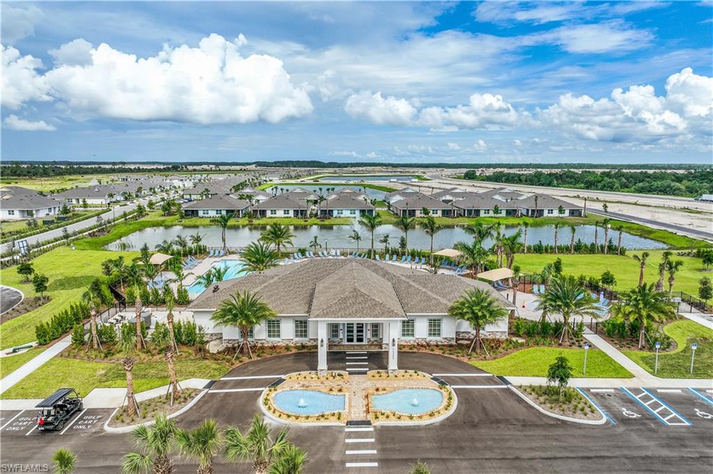 17770 Shade Tree Loop Punta Gorda, FL 33982 - Photo 41 of 47 a view of a swimming pool with a table under an umbrella
