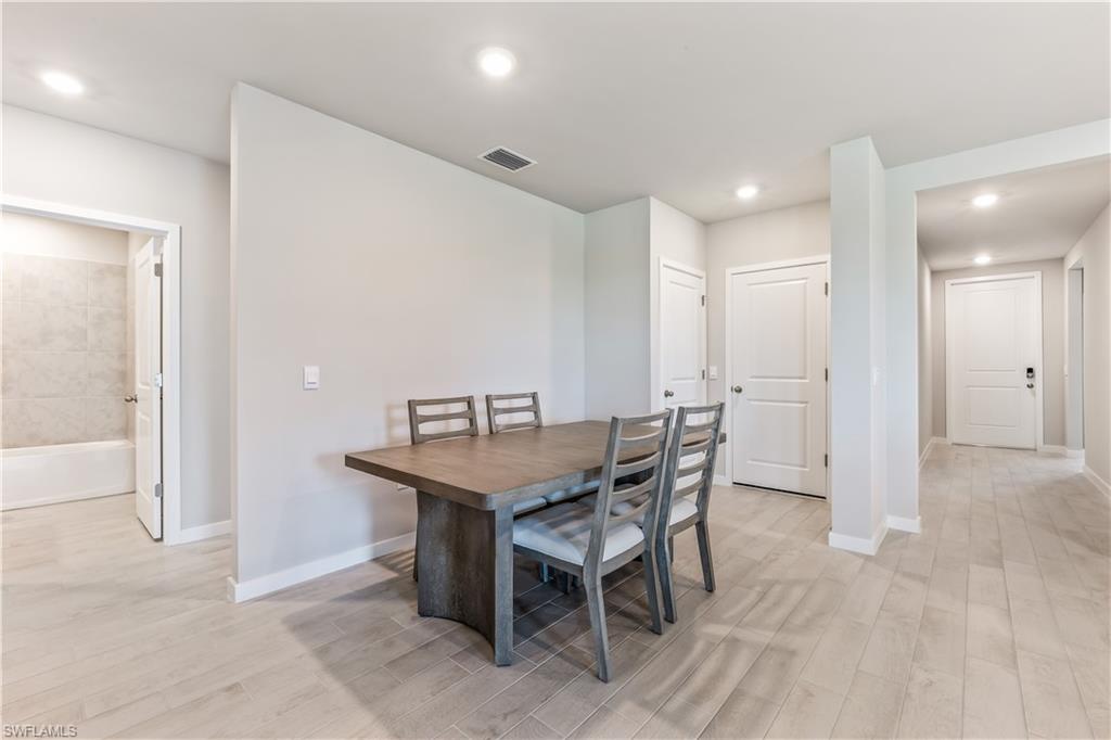 17770 Shade Tree Loop Punta Gorda, FL 33982 - Photo 7 of 47 a view of a dining room with furniture