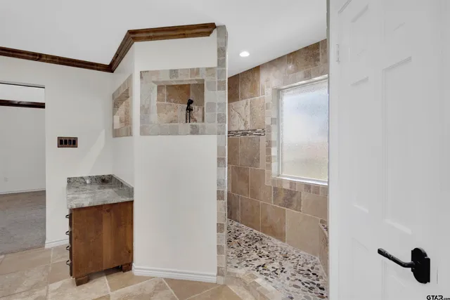 an empty room with windows and closet