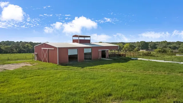 a view of a house with a big yard