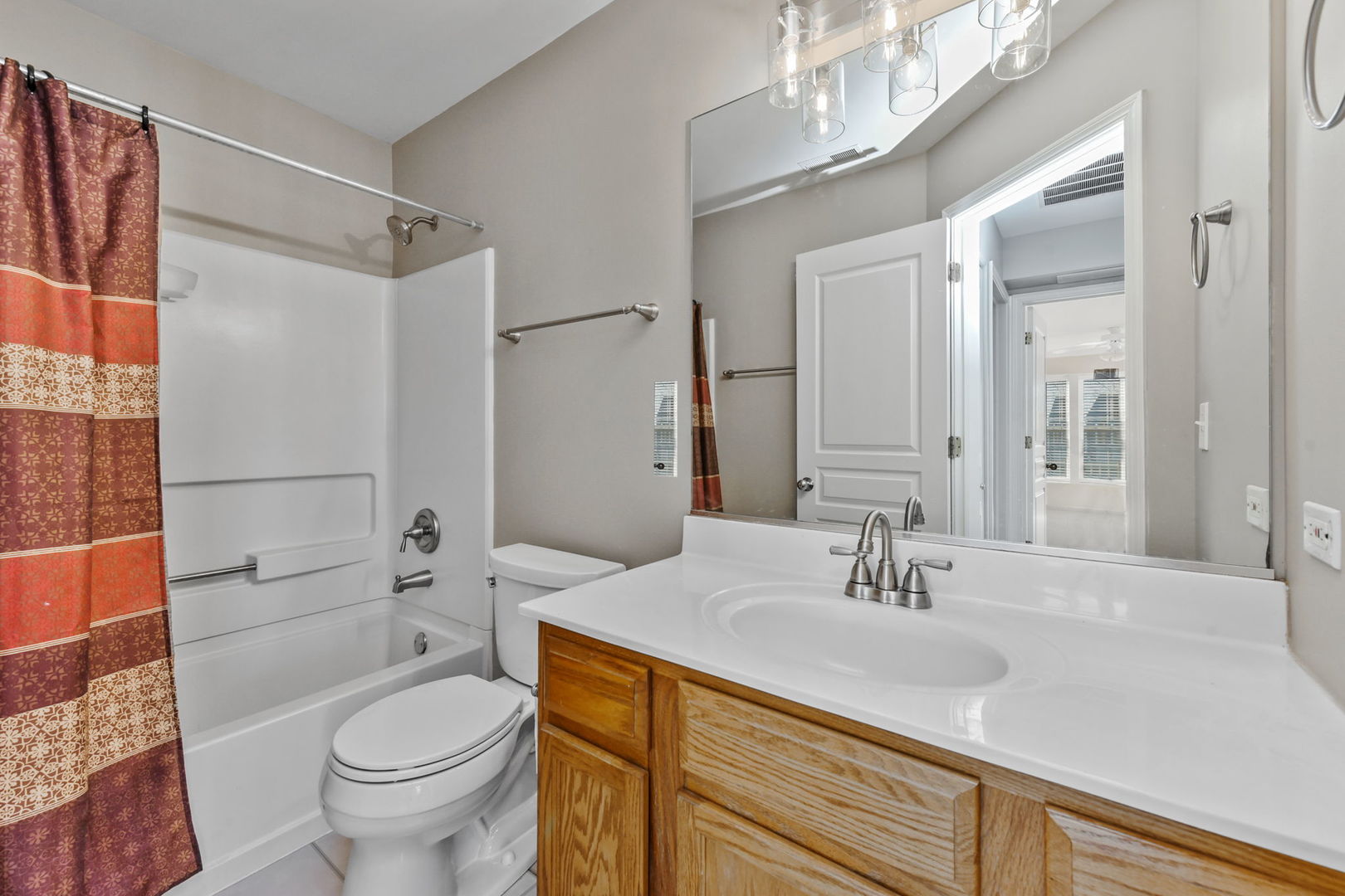 3142 Bromley Lane Aurora, IL 60502 - Photo 11 of 15 a bathroom with a sink toilet vanity and shower