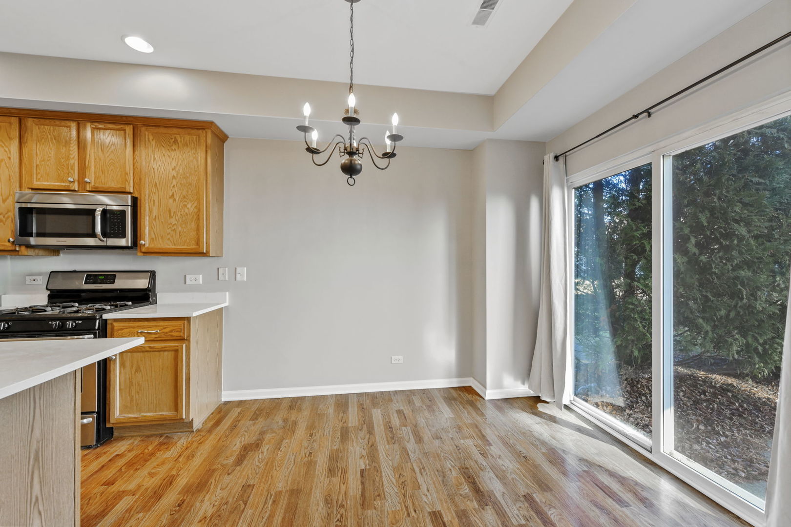 3142 Bromley Lane Aurora, IL 60502 - Photo 6 of 15 a view of a kitchen with a sink wooden floor and cabinets