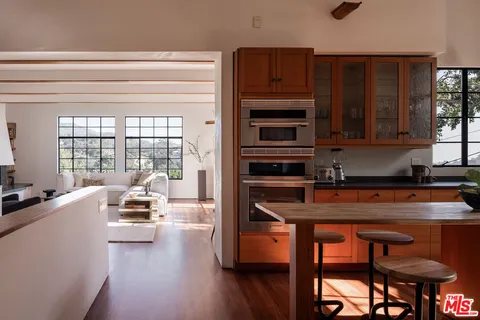 a bedroom with furniture and a window