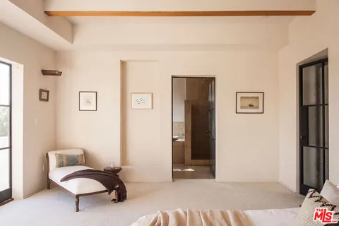 a bathroom with a tub and a window