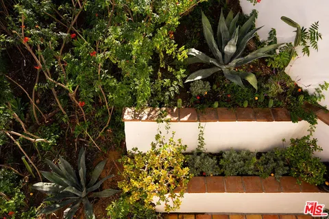 an aerial view of residential house with green space
