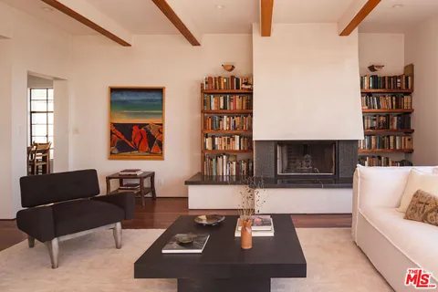 a living room with furniture and a table