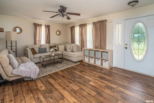 a living room with furniture and a rug