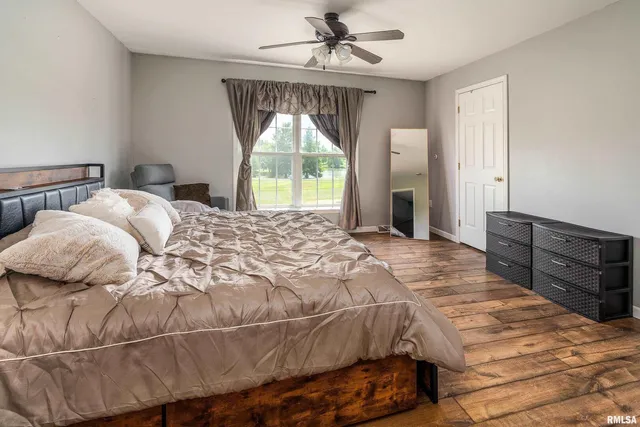 a bedroom with a bed and lamp