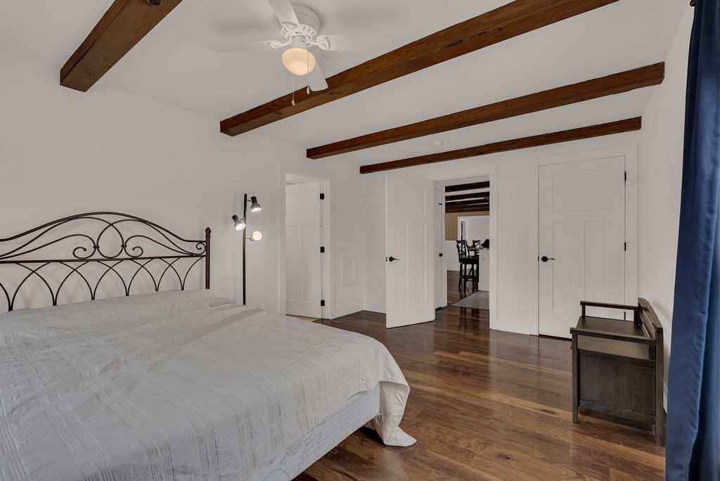 2165 Ben Mason Road Cookeville, TN 38506 - Photo 12 of 52 a bedroom with a bed and a ceiling fan