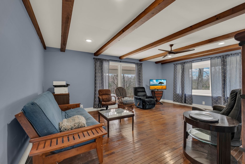 2165 Ben Mason Road Cookeville, TN 38506 - Photo 13 of 52 a living room with furniture a flat screen tv and wooden floor
