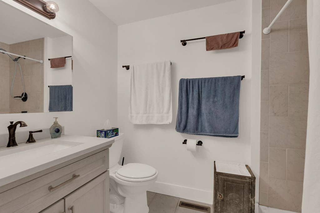 2165 Ben Mason Road Cookeville, TN 38506 - Photo 17 of 52 a bathroom with a toilet sink and mirror