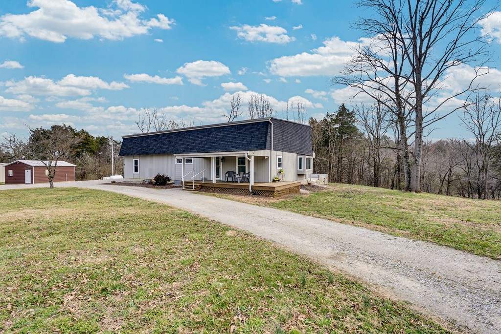 2165 Ben Mason Road Cookeville, TN 38506 - Photo 22 of 52 a front view of house with yard and trees around