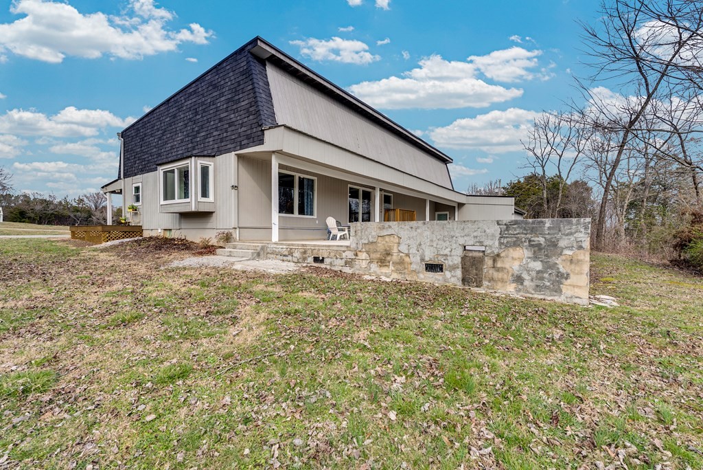 2165 Ben Mason Road Cookeville, TN 38506 - Photo 23 of 52 a front view of a house with a yard