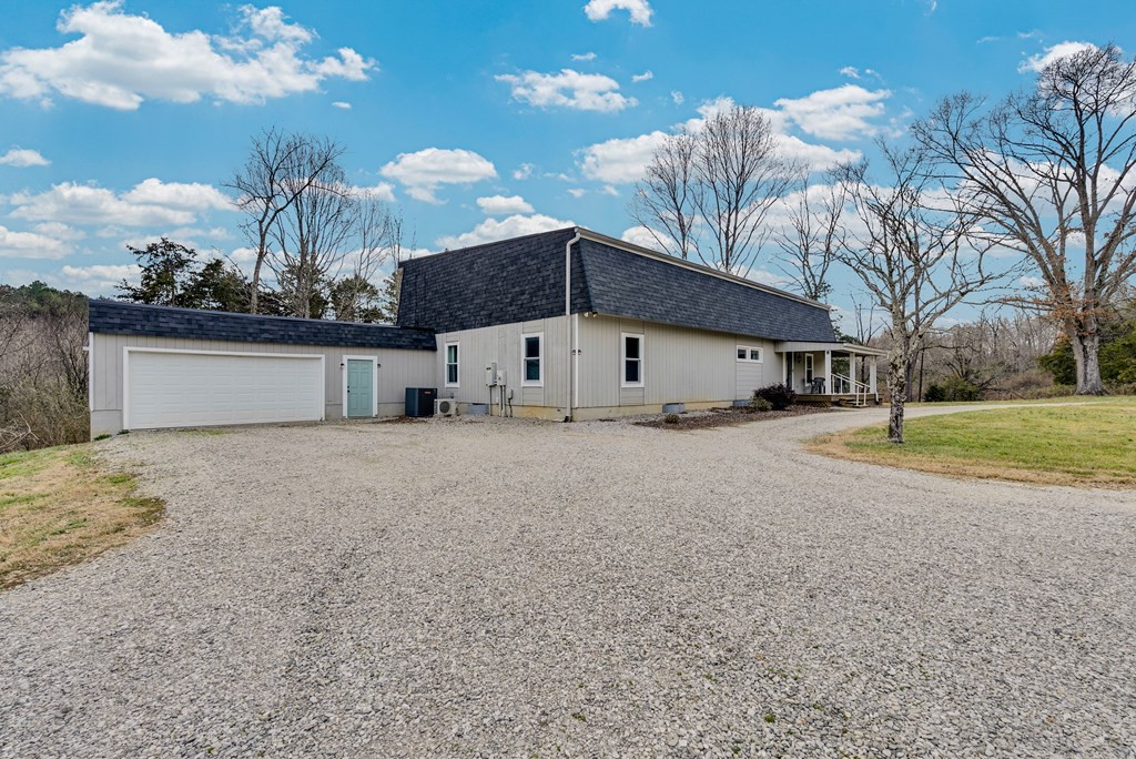 2165 Ben Mason Road Cookeville, TN 38506 - Photo 25 of 52 a view of a house with a yard