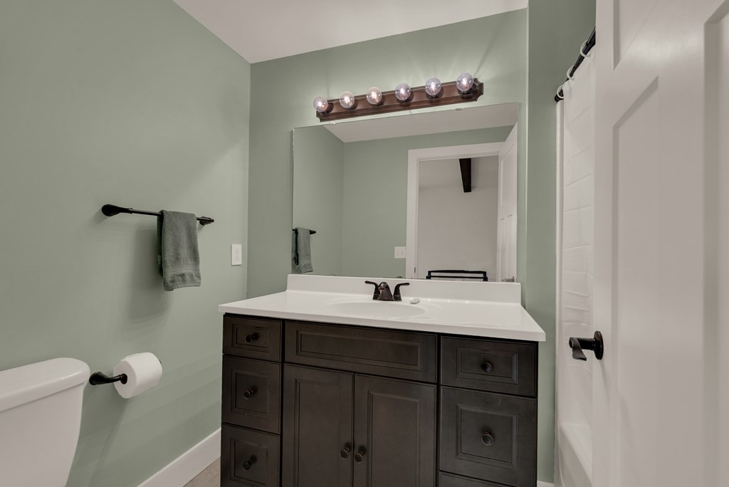2165 Ben Mason Road Cookeville, TN 38506 - Photo 26 of 52 a bathroom with a sink and a mirror