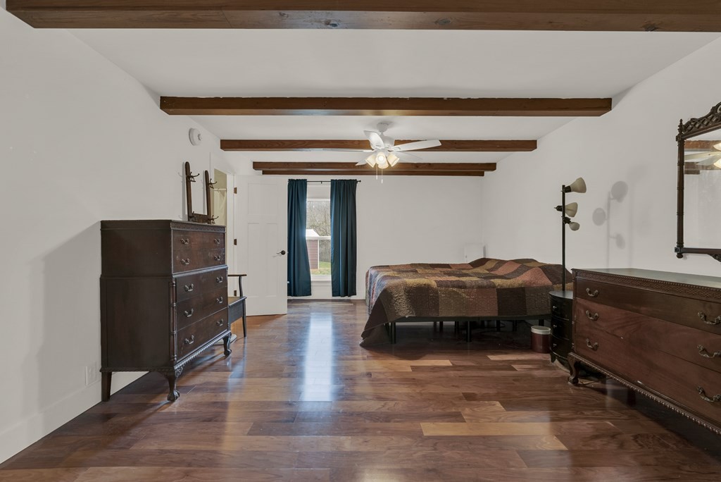 2165 Ben Mason Road Cookeville, TN 38506 - Photo 27 of 52 a bedroom with a bed and wooden floor