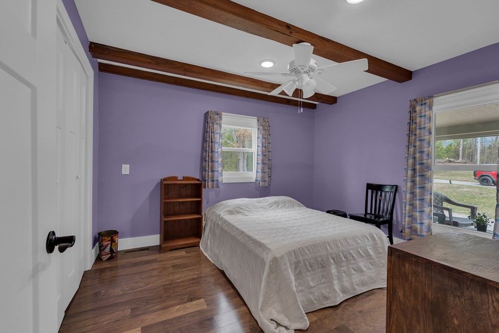 2165 Ben Mason Road Cookeville, TN 38506 - Photo 28 of 52 a bedroom with a bed and a chandelier