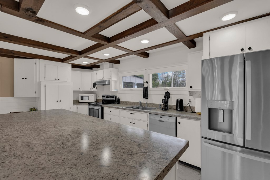 2165 Ben Mason Road Cookeville, TN 38506 - Photo 4 of 52 a kitchen with stainless steel appliances granite countertop a sink window and refrigerator