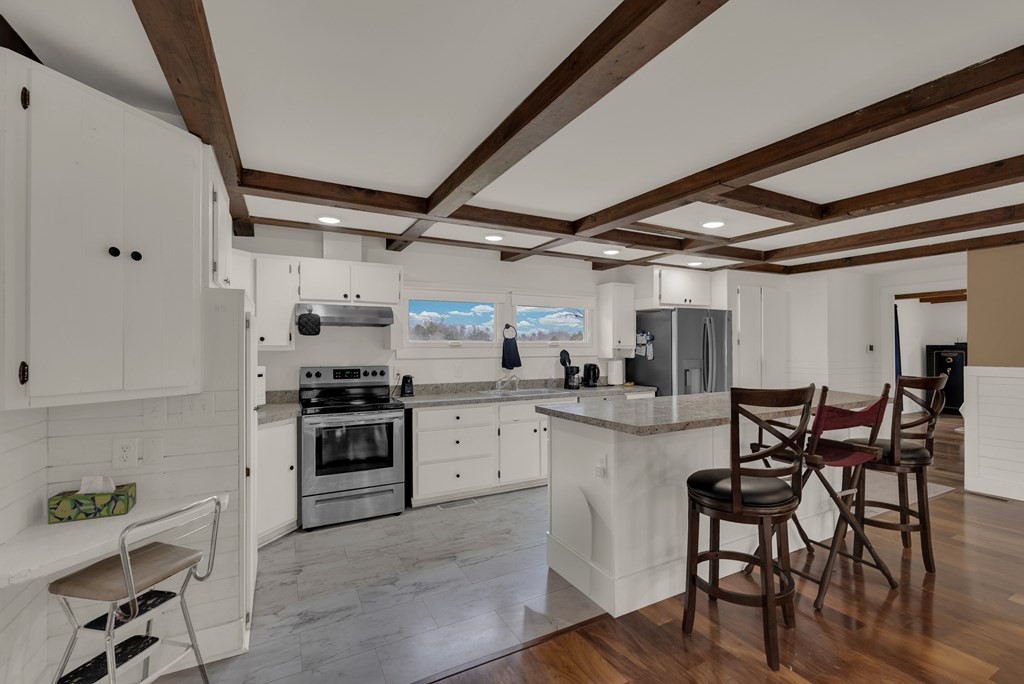 2165 Ben Mason Road Cookeville, TN 38506 - Photo 6 of 52 a kitchen with stainless steel appliances granite countertop a stove and cabinets