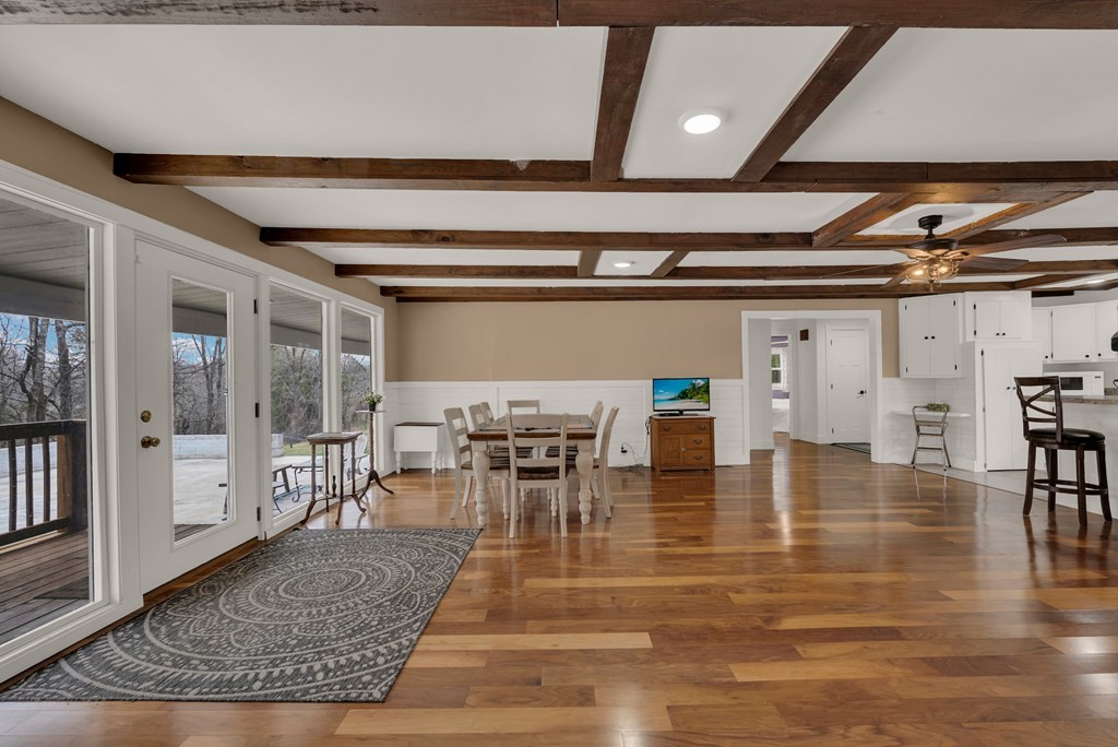 2165 Ben Mason Road Cookeville, TN 38506 - Photo 9 of 52 a dining room with furniture wooden floor and a rug