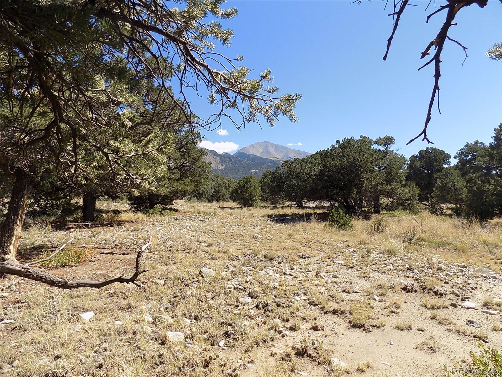 Little Bear Road Mosca, CO 81146 - Photo 8 of 22 a view of a backyard of the house