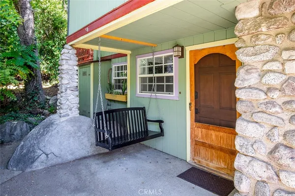 a view of front door and wooden floor
