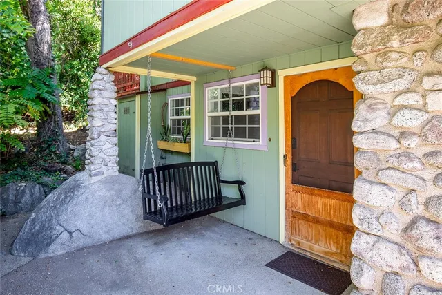 a view of front door and wooden floor