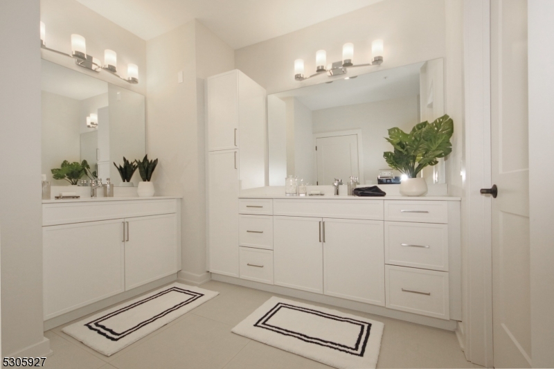 30 Court Street Morristown, NJ 07960 - Photo 7 of 27 a bathroom with a sink vanity and a mirror