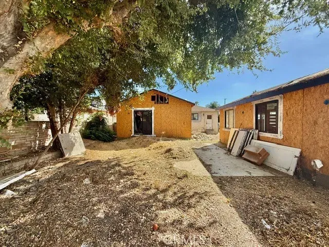 a view of a backyard of the house