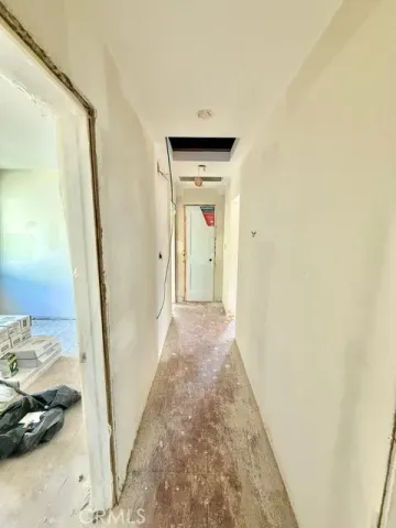 a view of a hallway view with a in front door