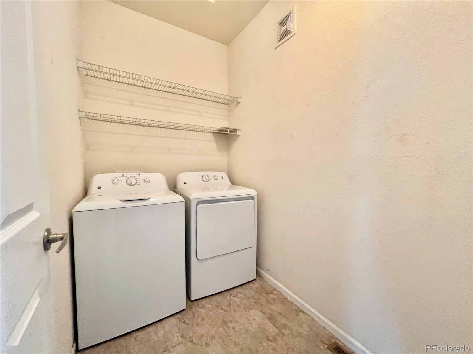 1385 South Chambers Road, Unit 102 Aurora, CO 80017 - Photo 19 of 20 a utility room with dryer and washer