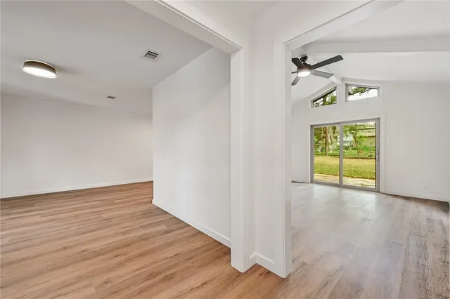 a view of an entryway with wooden floor