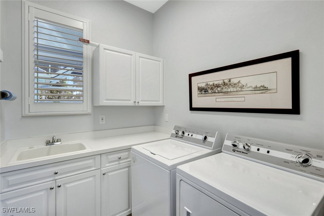 2450 Wulfert Road Sanibel, FL 33957 - Photo 34 of 44 a utility room with dryer and washer