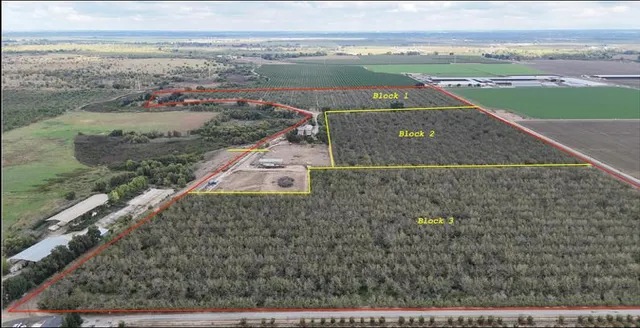 an aerial view of a residential houses with outdoor space