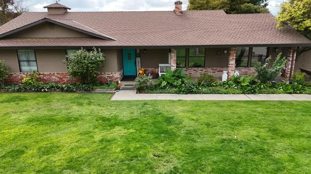 a view of a house with a garden